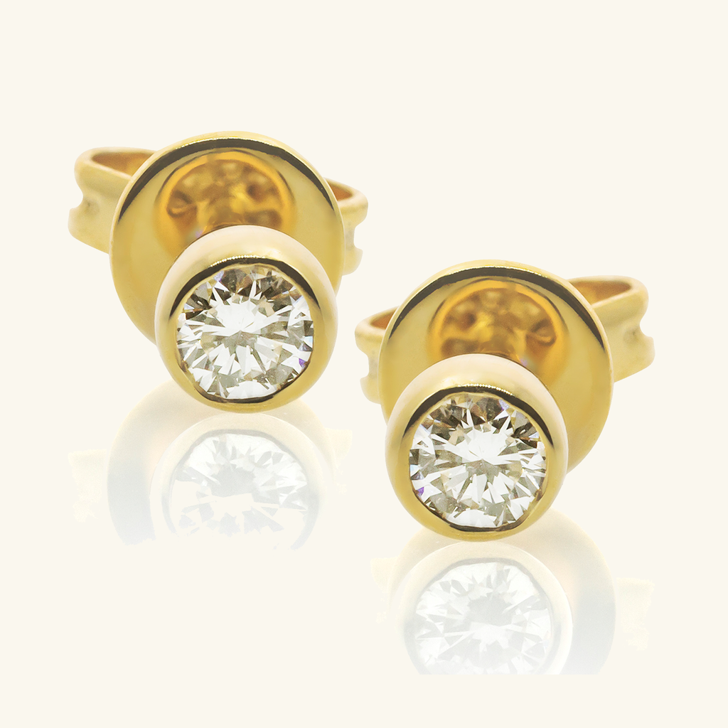 Round Diamond Mini Studs, Made in solid 14k gold. The brilliant round cut diamond is handcrafted with clean cut lines and maximum shine
