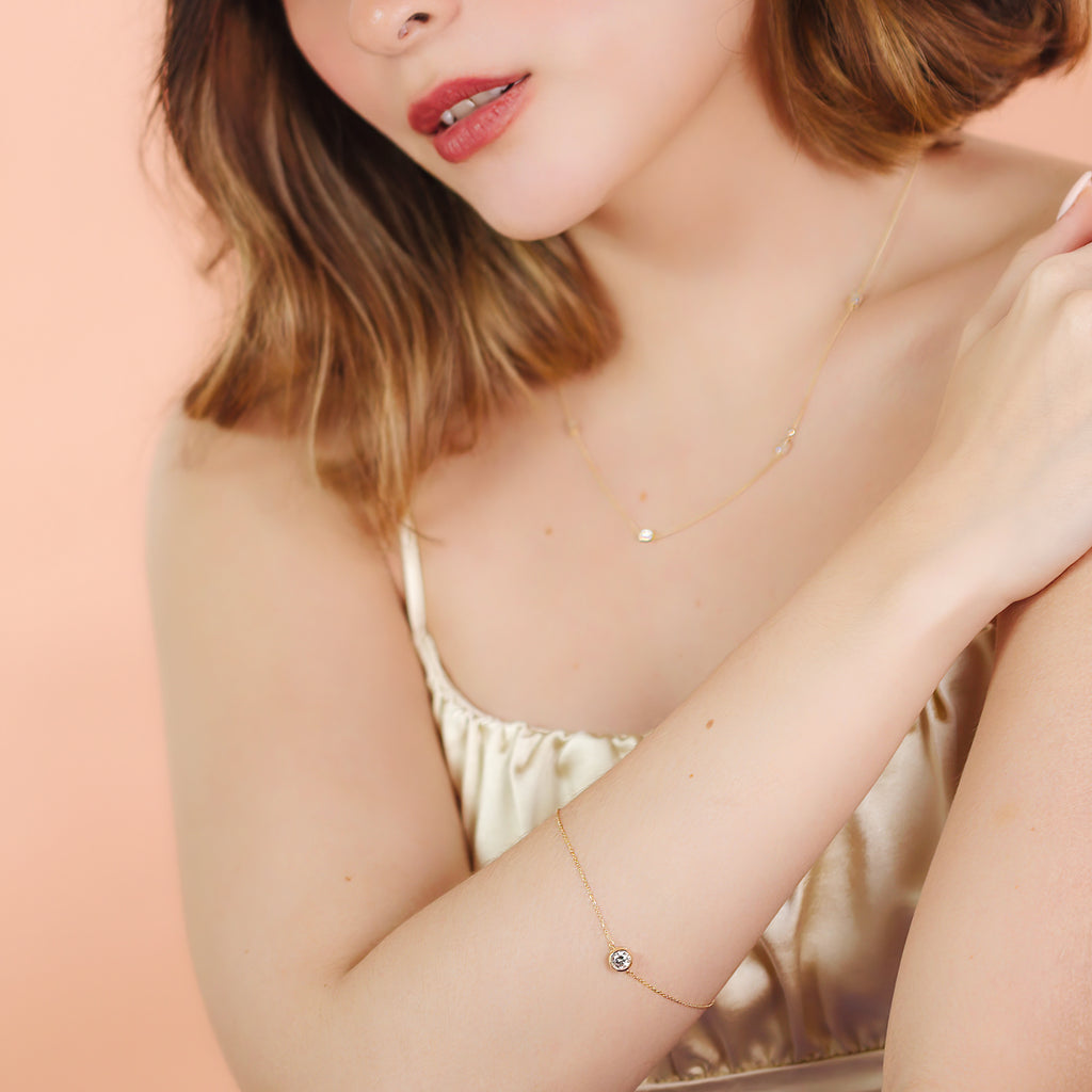 14k Solo Bezel Bracelet 14k gold stacked on model wrist – Foundry