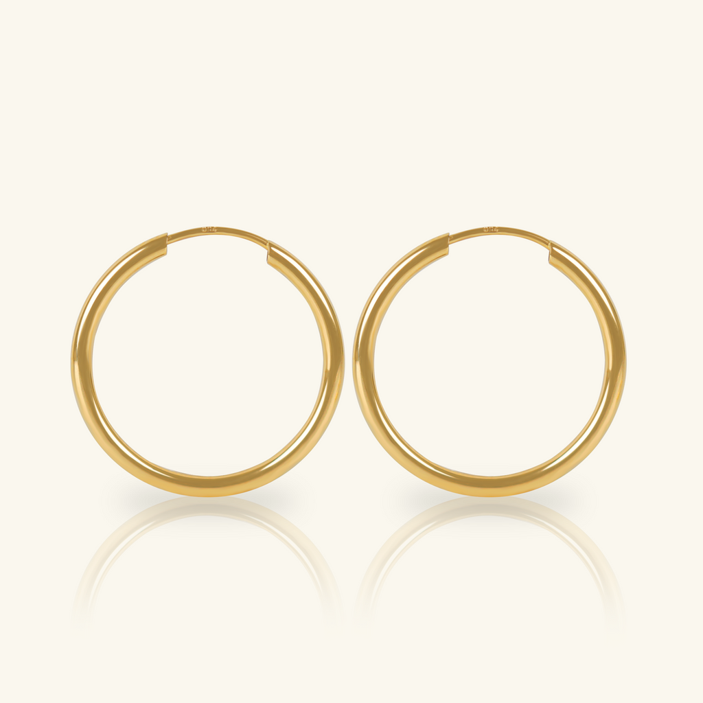 Medium Easy Hoops, Made in 18k hallowed gold.