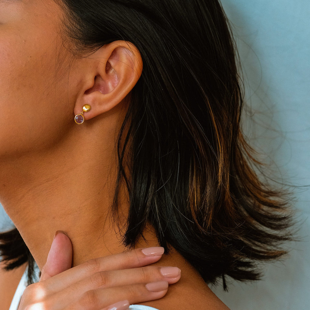 Antoinette Drops Violet Crystal 18k gold stacked on model ears – Foundry