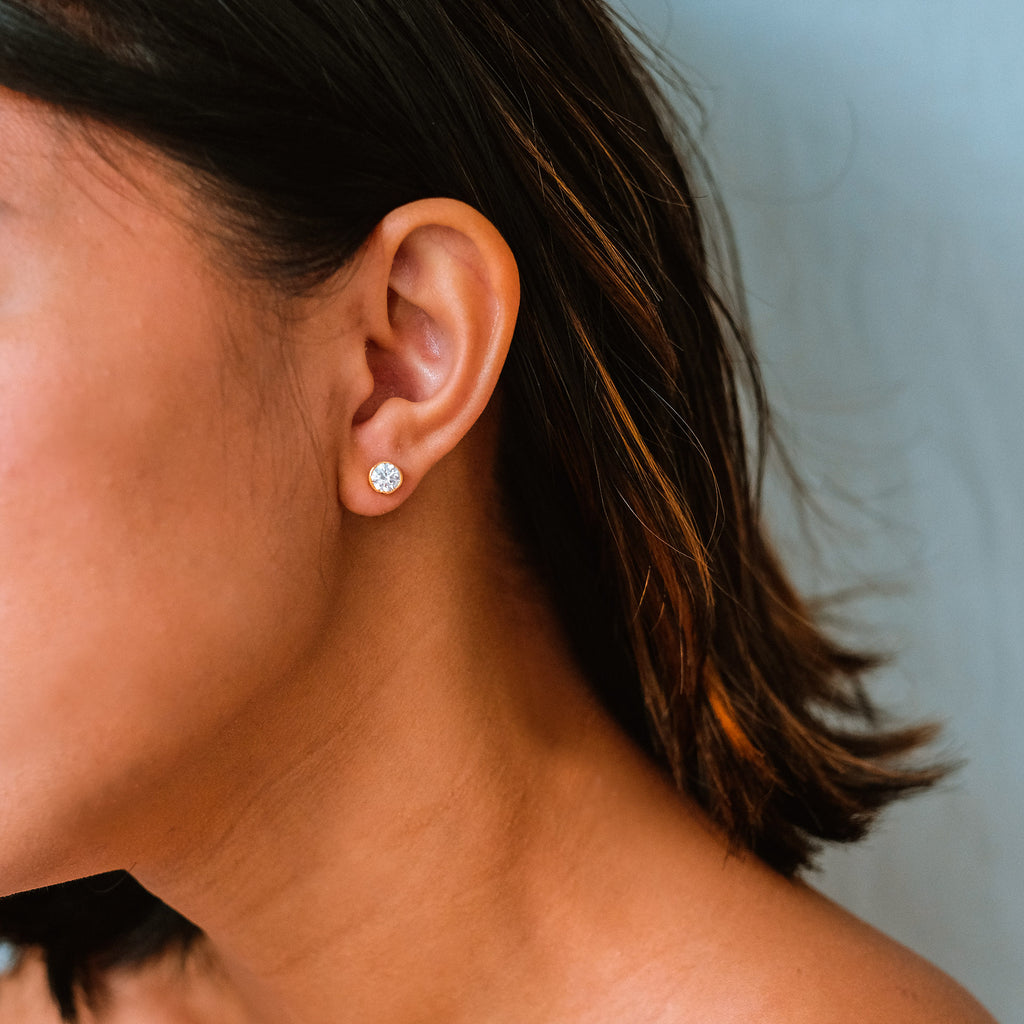Arden Studs Earrings 18k gold stacked  on model ears – Foundry