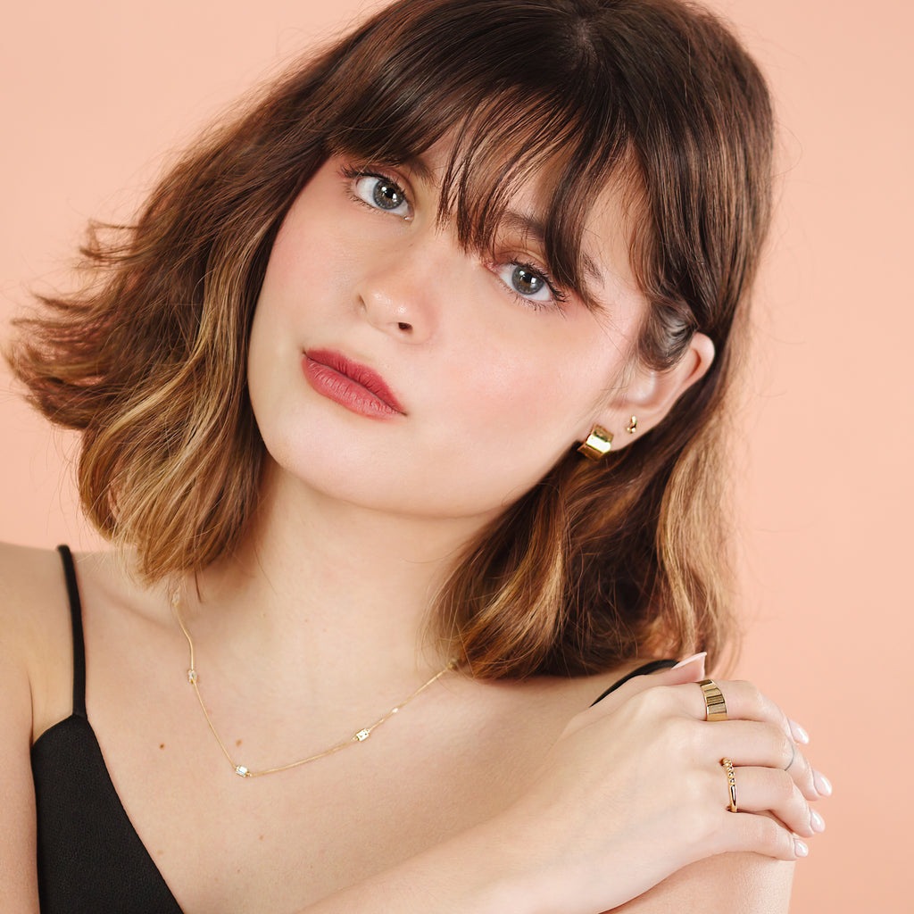 Baguette Cut Cz Necklace 14k gold stacked on model neck – Foundry