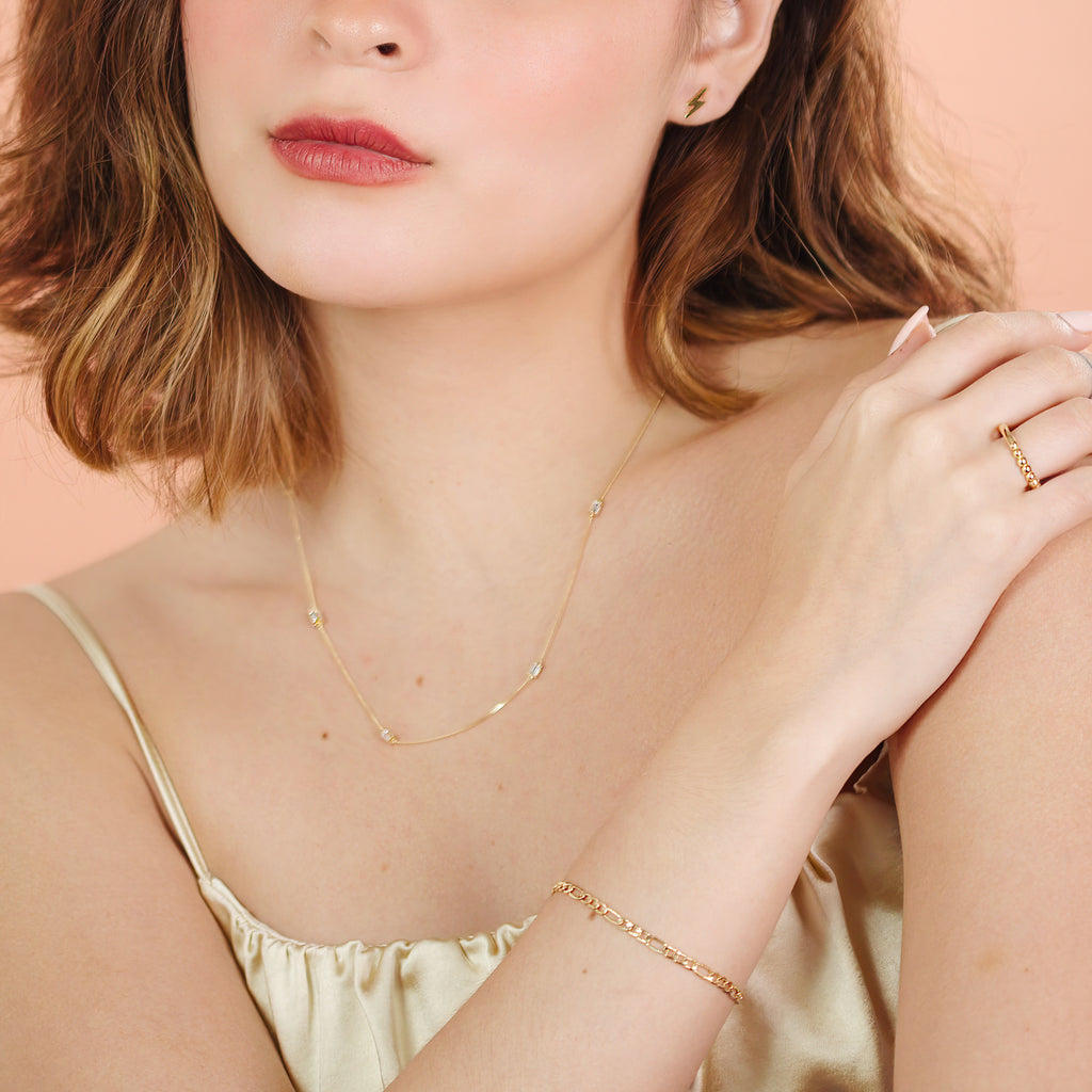 Baguette Cut Cz Necklace 14k gold stacked on model neck – Foundry