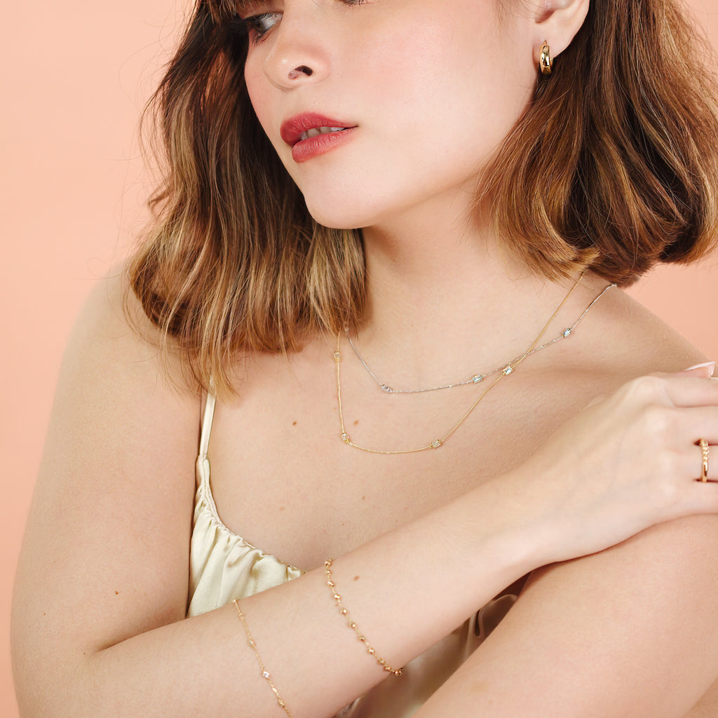 Baguette Cut Cz necklace 14k white gold stacked on model neck – Foundry