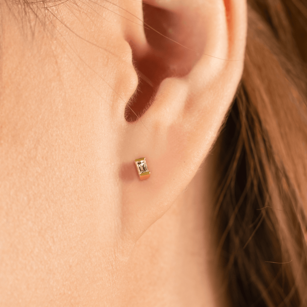 Baguette Diamond Studs 14k gold stacked with on model ears – Foundry