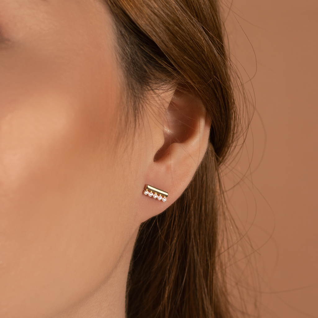 Bar Duo Studs 14k gold stacked on model ear – Foundry