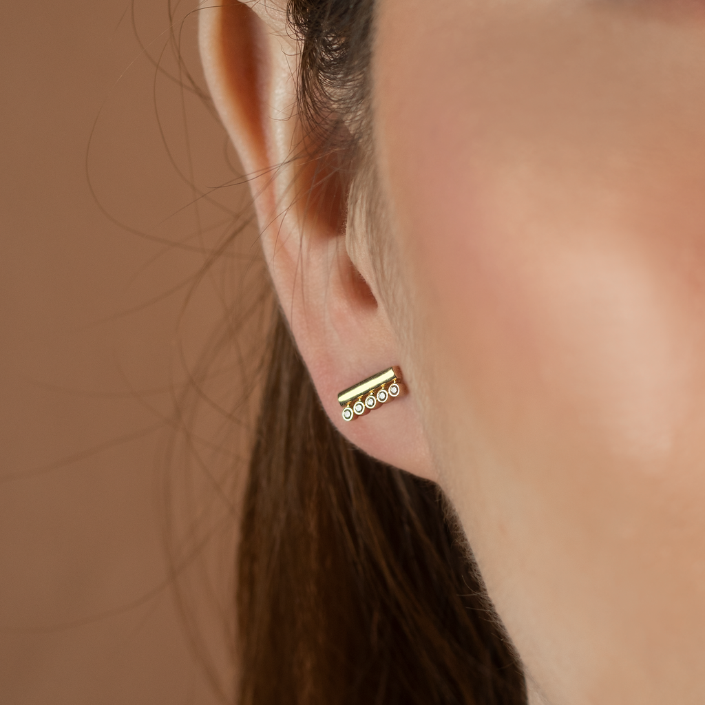 Bar Duo Studs 14k gold stacked on model ear – Foundry