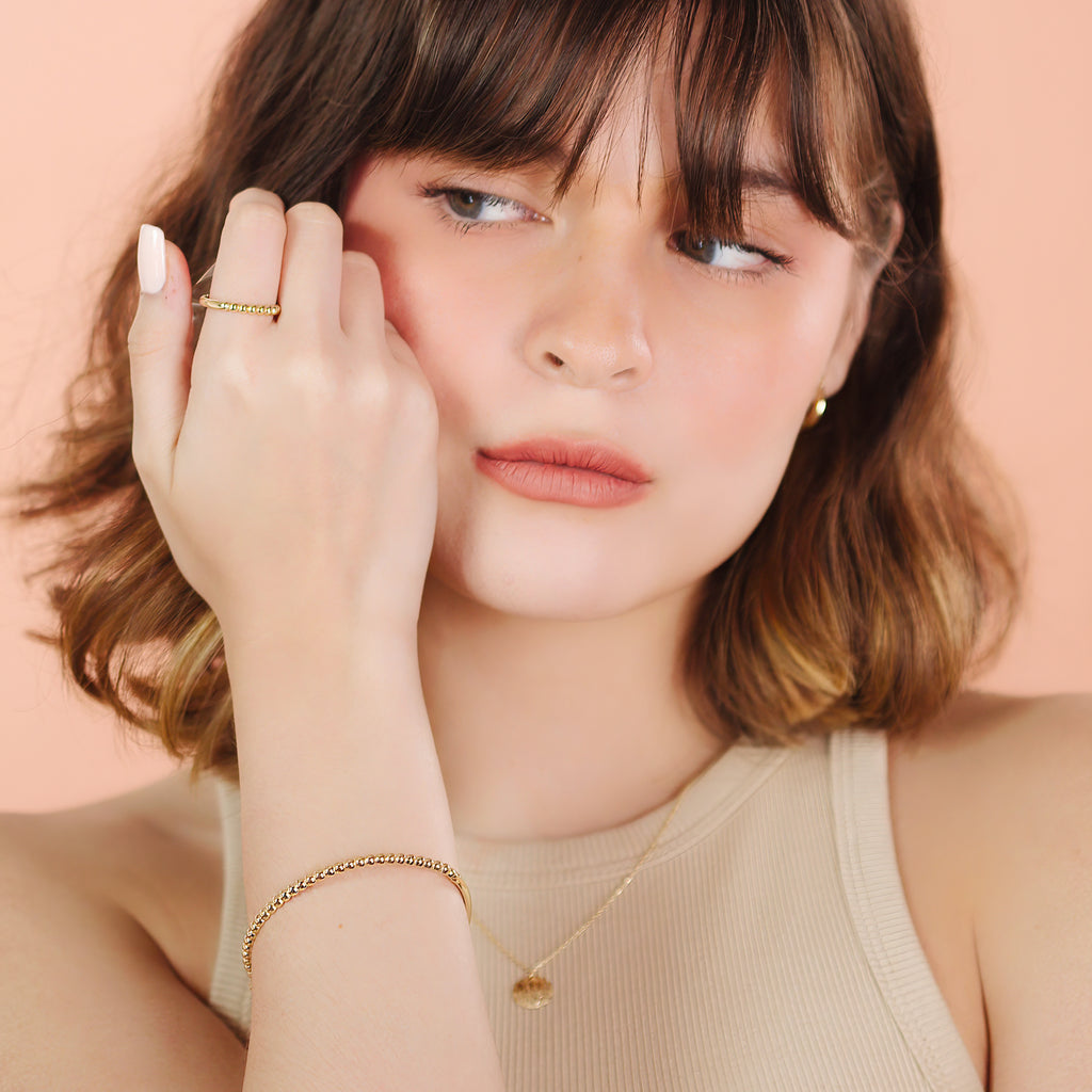 Beads Bold Bangle 14k gold stacked on model wrist – Foundry