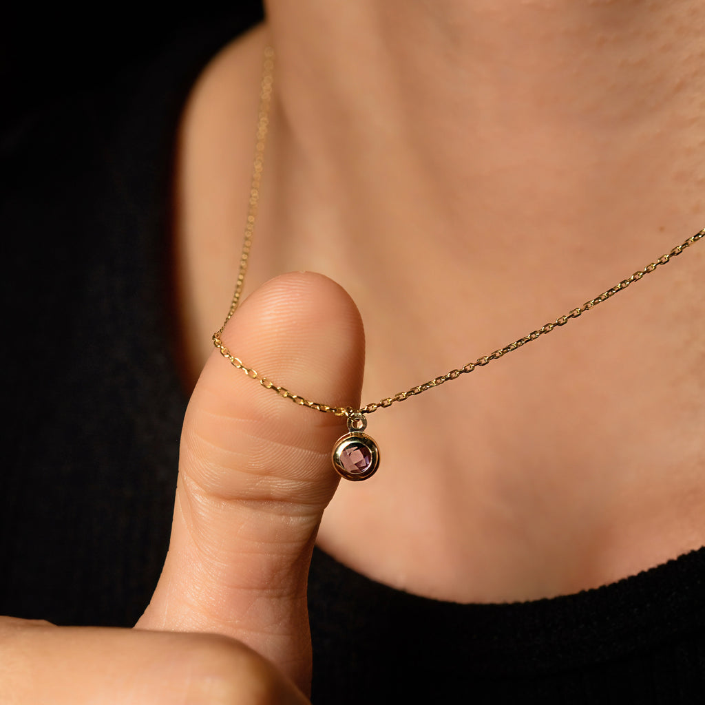 Birthstone Sphere Necklace 14k gold stacked on model neck – Foundry