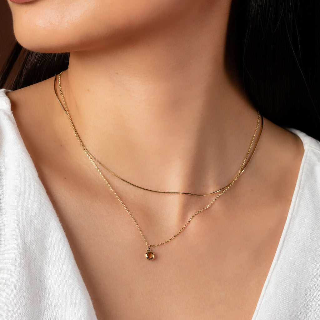 Birthstone Spheres Necklace Citrine 14k gold stacked on model neck – Foundry