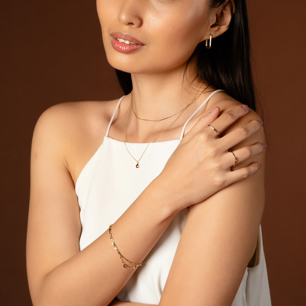 Anchor Chain Bracelet 14k gold stacked on model wrist – Foundry