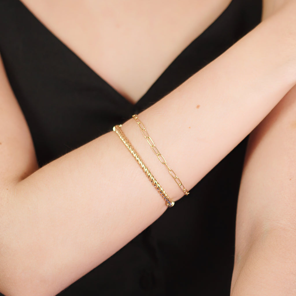 Boyfriend Bracelet 14k gold stacked on model wrist – Foundry