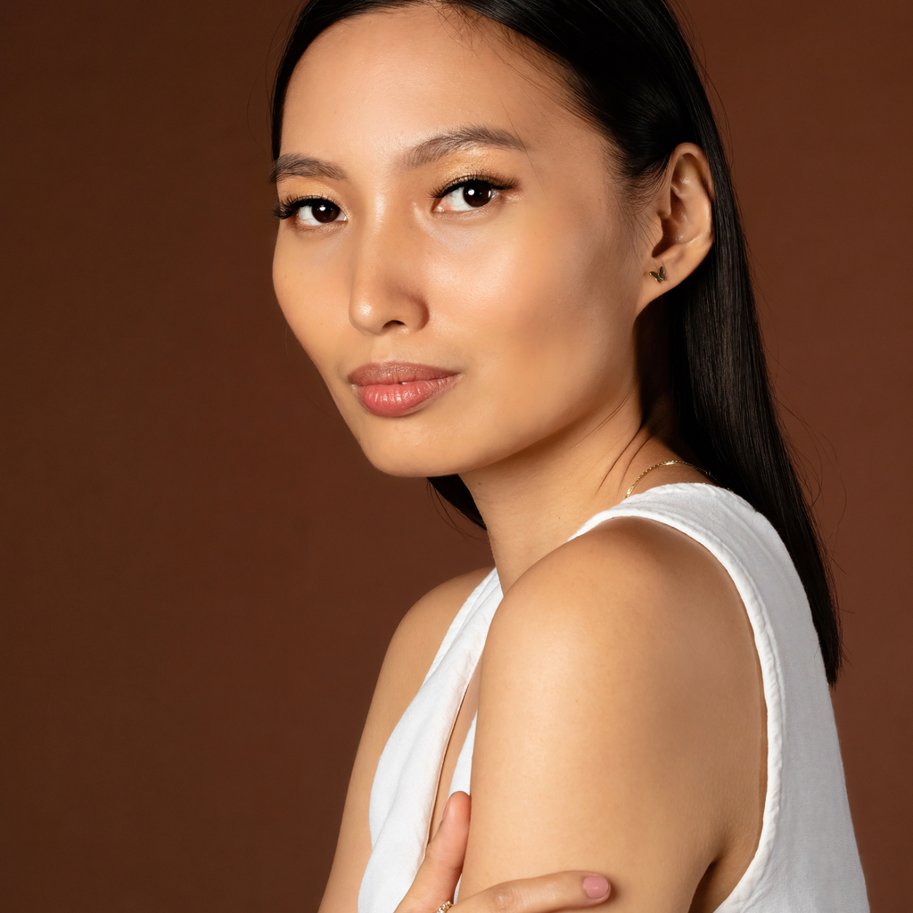 Butterfly Studs 14k gold stacked on model ear – Foundry