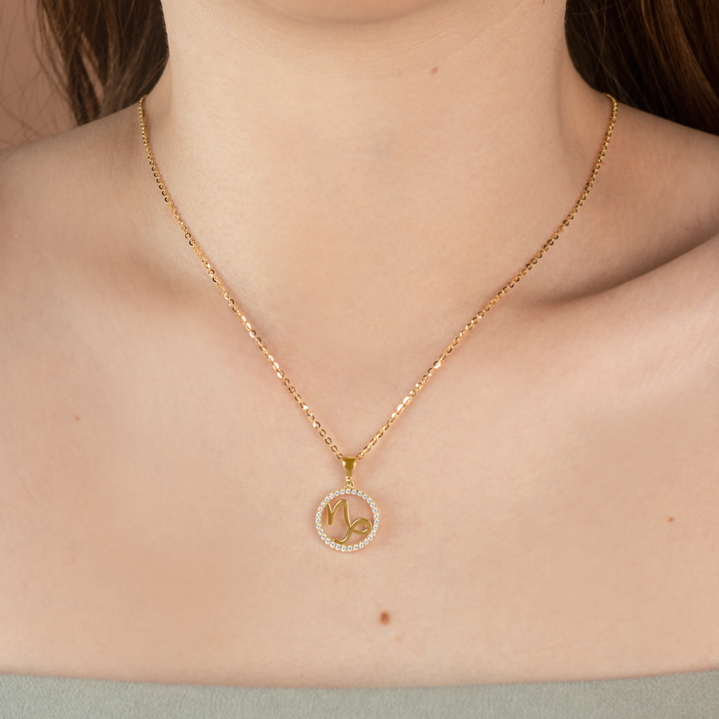 Capricorn Pendant 14k gold stacked on model neck– Foundry