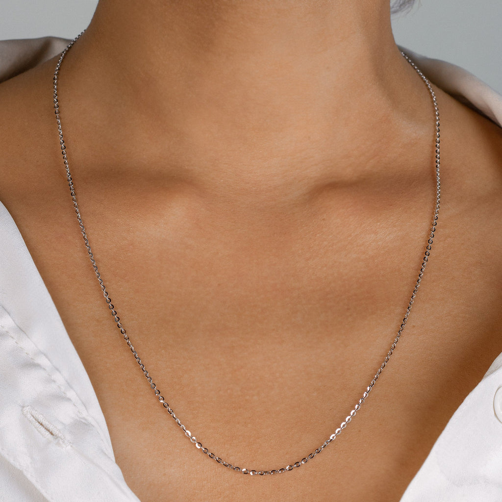 Chain Necklace 18k white gold stacked on model neck – Foundry