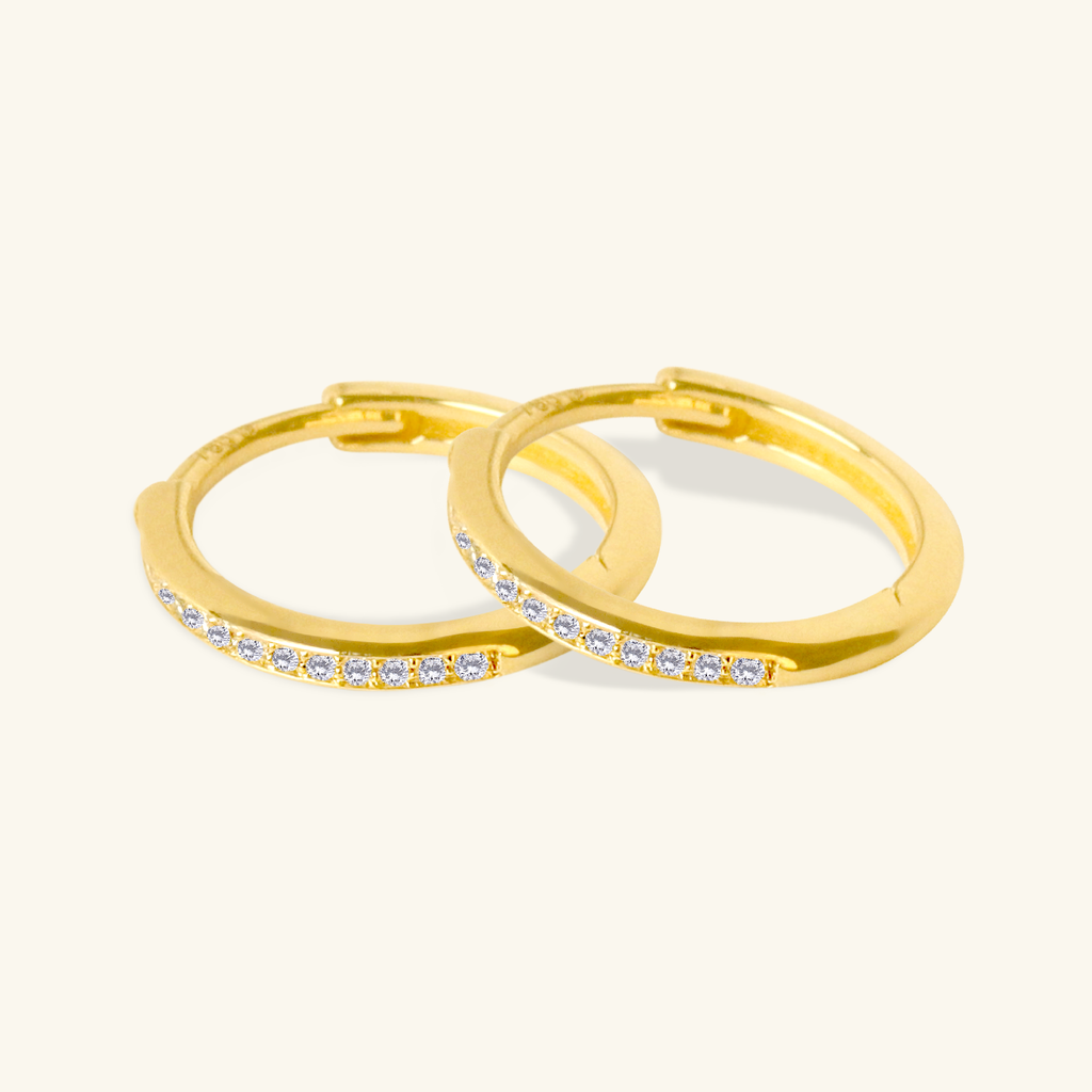 Close-up of saddle back on Channel Diamond  Huggie Hoops 18k gold – Foundry