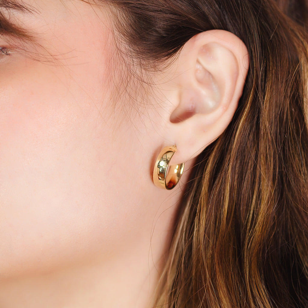 Chunky Hoops 14k gold stacked on model ear – Foundry