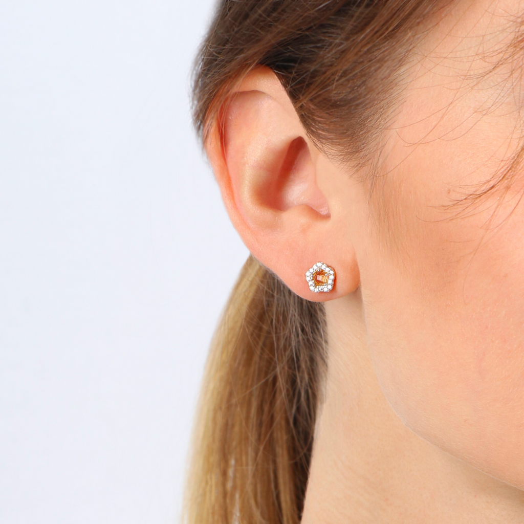 Citrine Flower Studs 18k gold stacked on model ear – Foundry