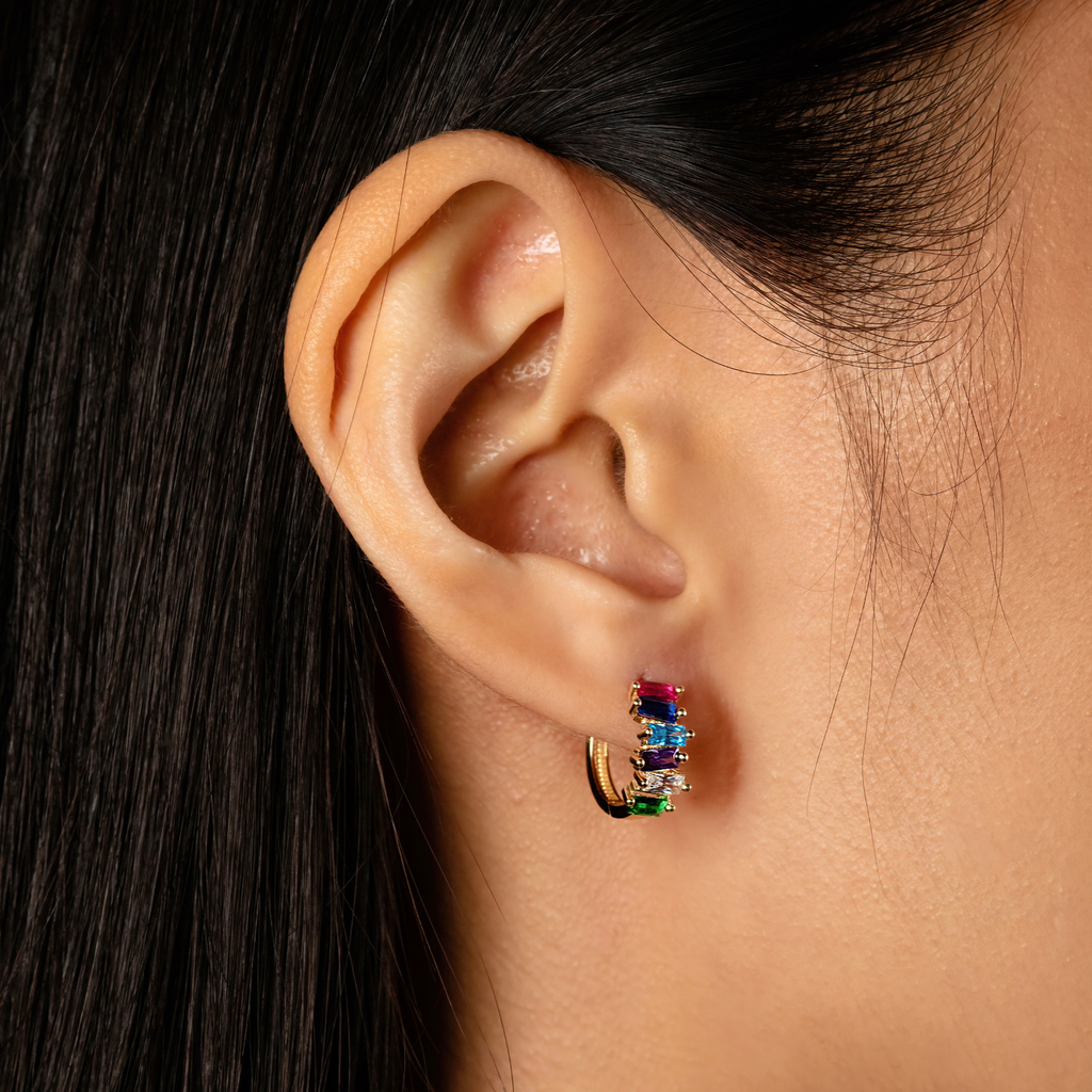Colored Cluster Baguette Hoops 14k gold stacked on model ear – Foundry
