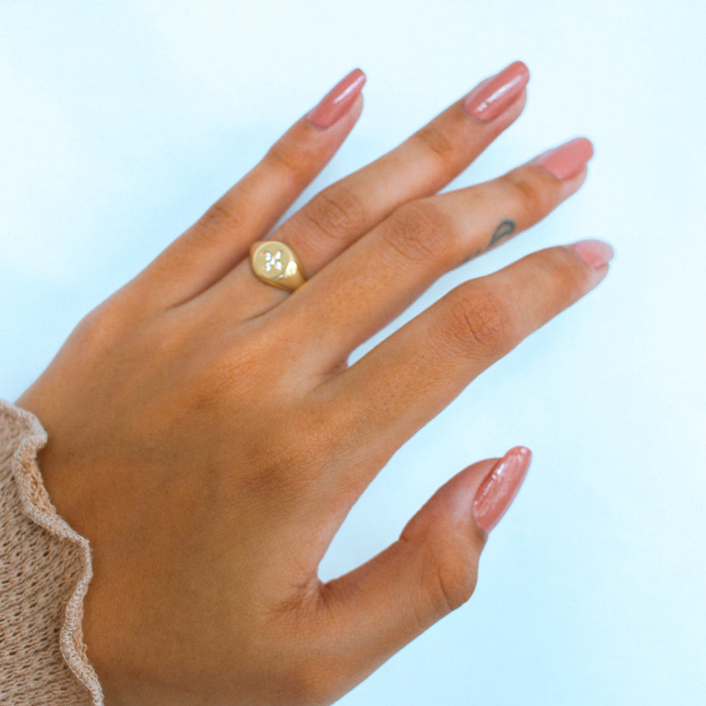 Crossing Signet Ring 18k gold stacked on model finger – Foundry