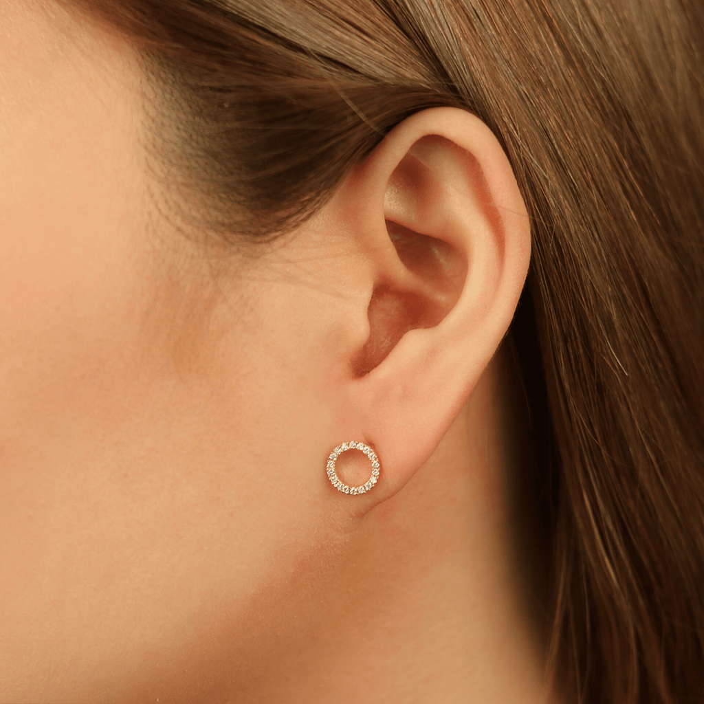 Diamond Halo Studs 14k gold stacked  on model ear – Foundry
