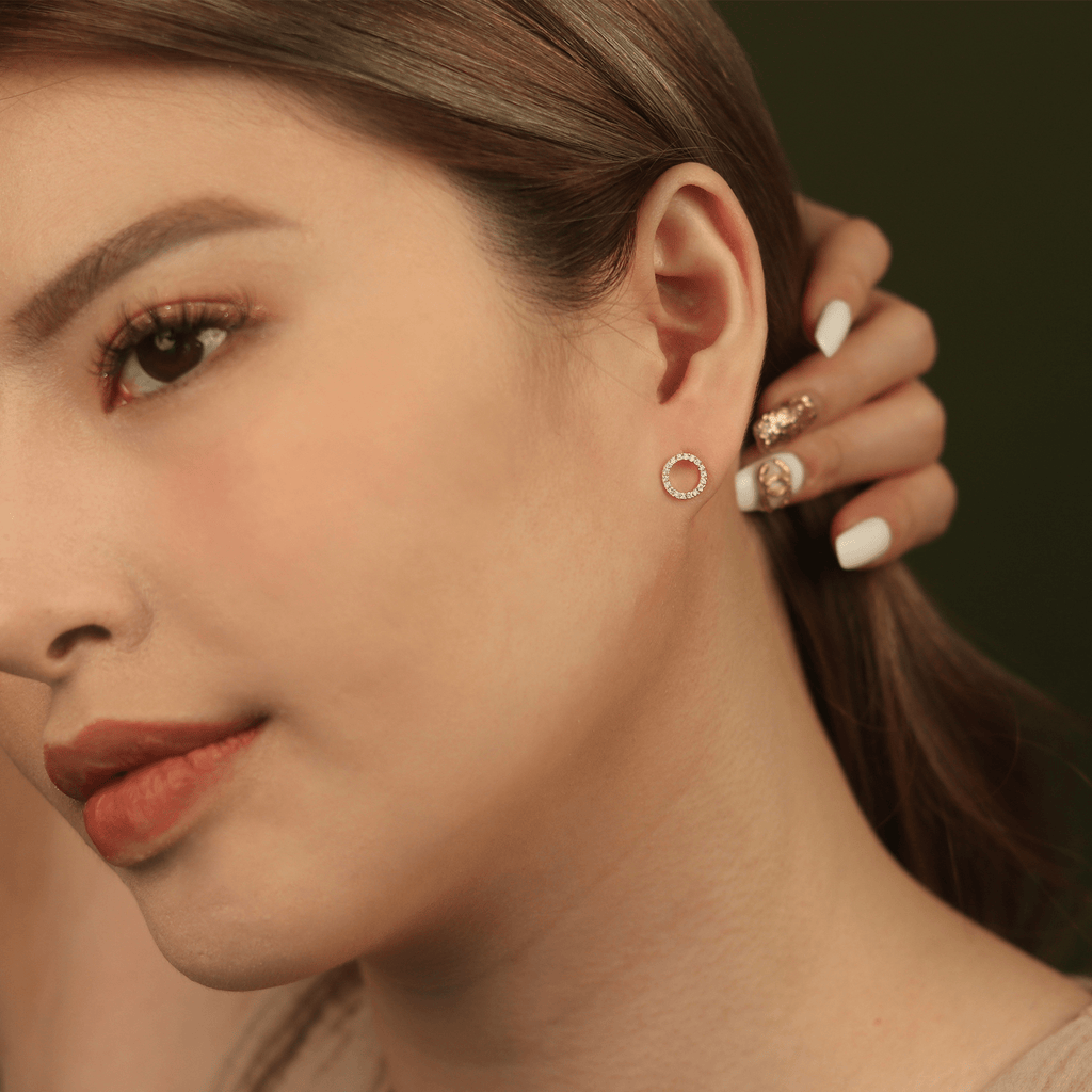 Diamond Halo Studs 14k gold stacked  on model ear – Foundry