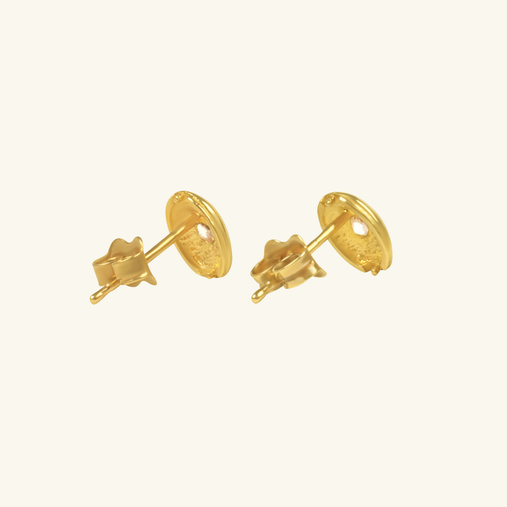 Close-up of Push back post lock clasp Dome Oval Stud Earrings on 14k gold – Foundry