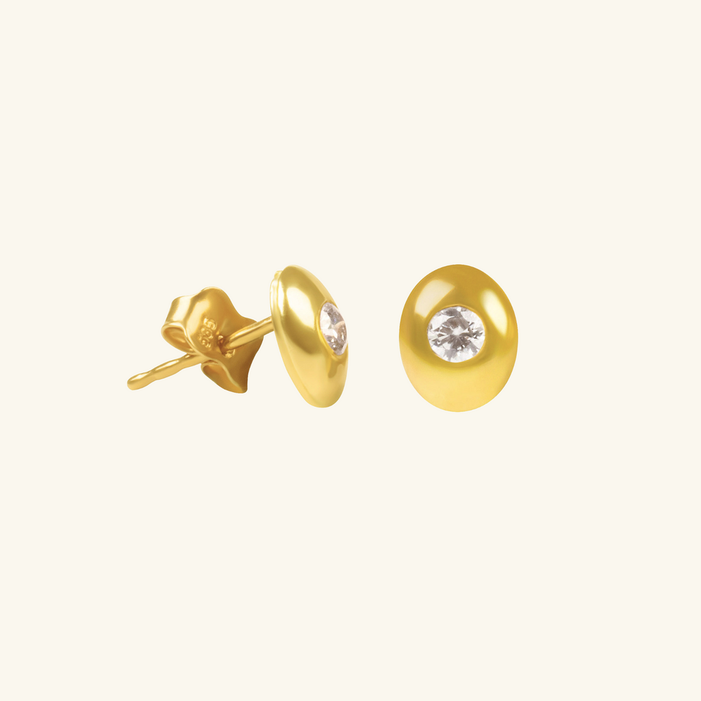 Close-up of Push back post lock clasp Dome Oval Stud Earrings on 14k gold – Foundry