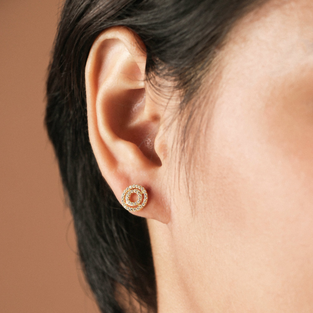 Double Halo Studs 18k gold stacked on model ear– Foundry