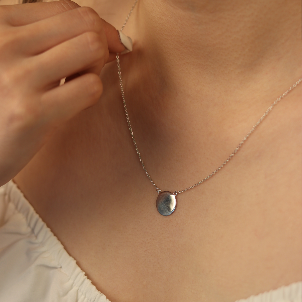 Engravable Blank Disc Necklace Sterling Silver stacked on model neck – Foundry