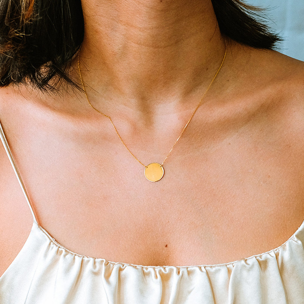 Engravable Gold Disc 14k gold stacked on model neck – Foundry