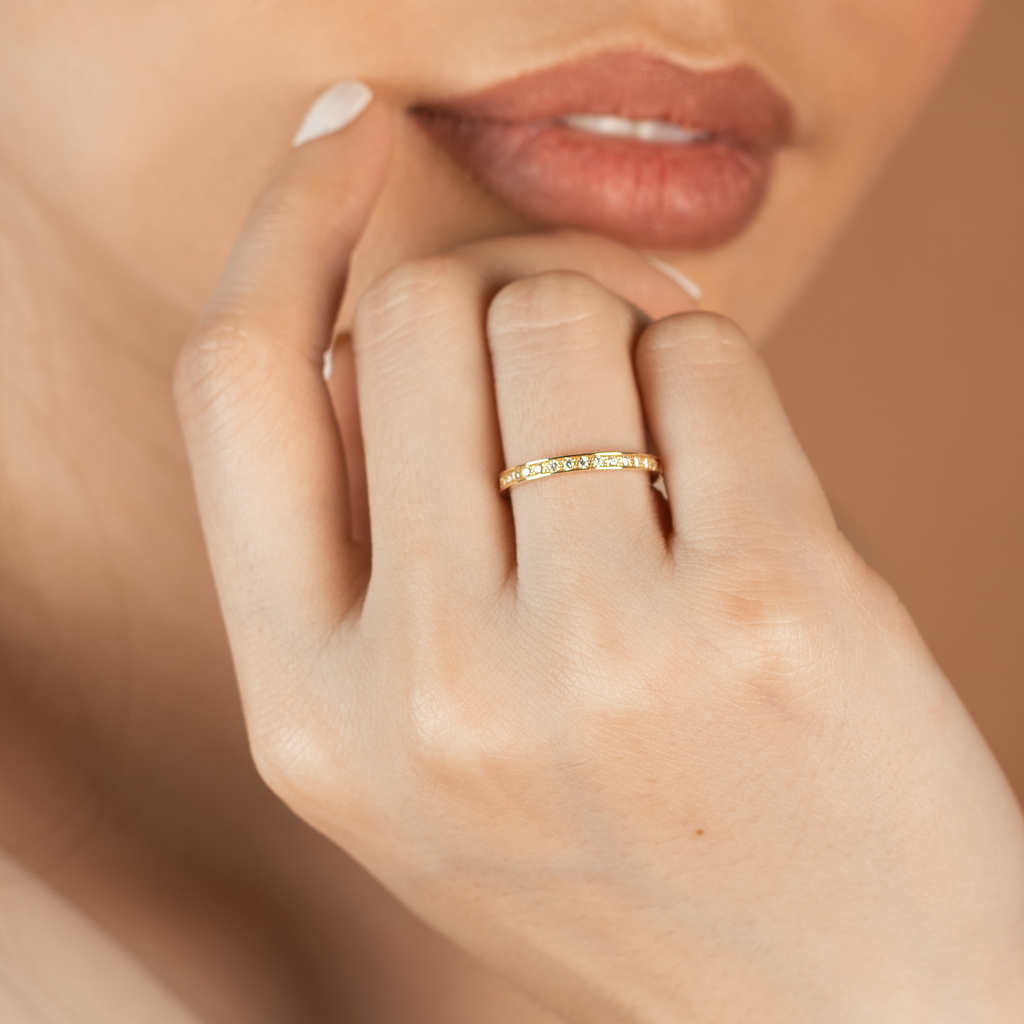 Essential Eternity Ring 14k gold stacked on model finger– Foundry