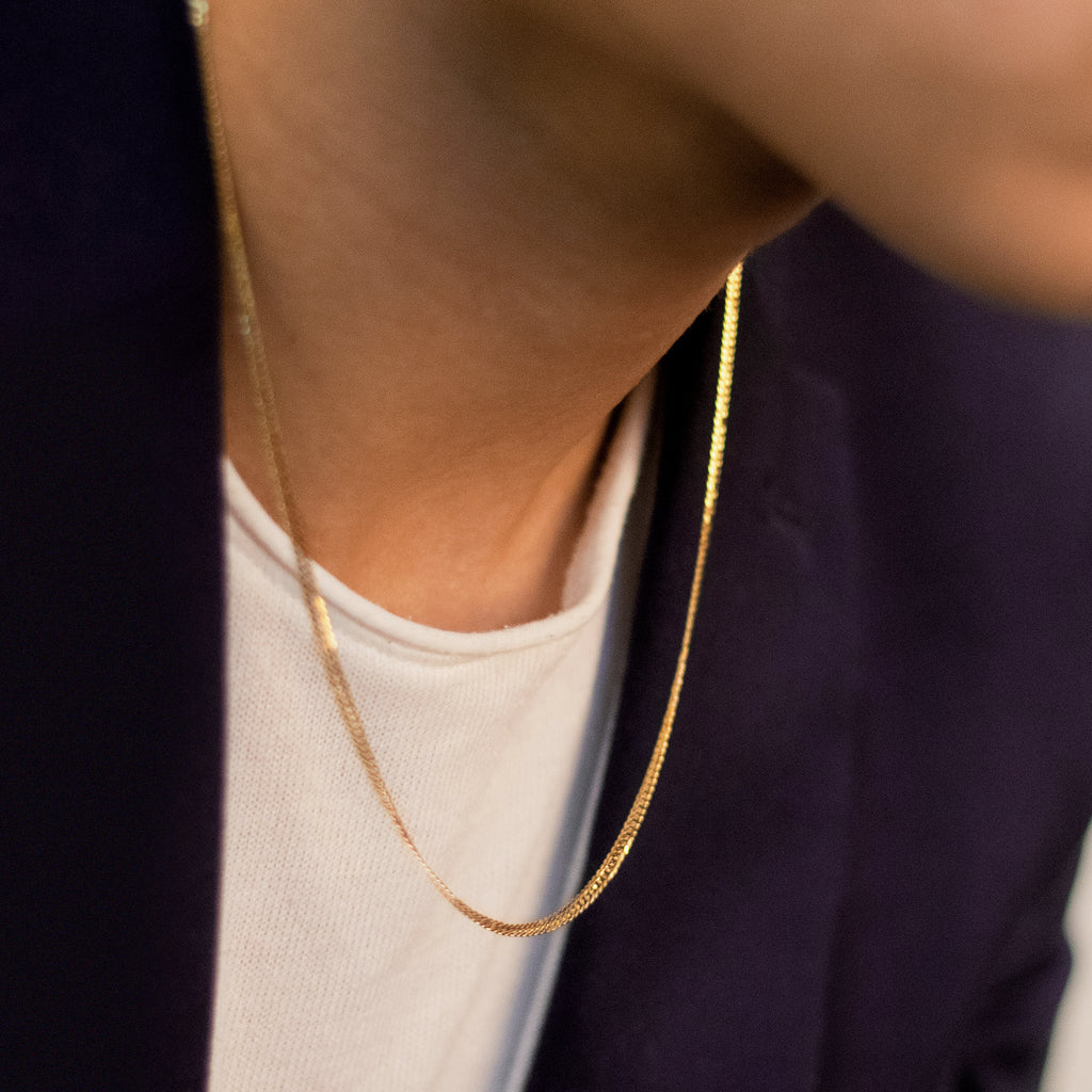 Flat Curb Necklace 18k gold stacked on model neck – Foundry