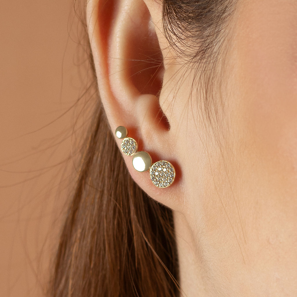 Flat Disc Climber Studs 14k gold stacked on model ear – Foundry