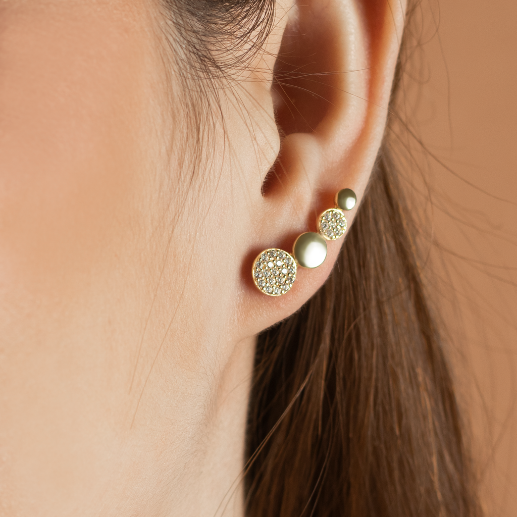 Flat Disc Climber Studs 14k gold stacked on model ear – Foundry