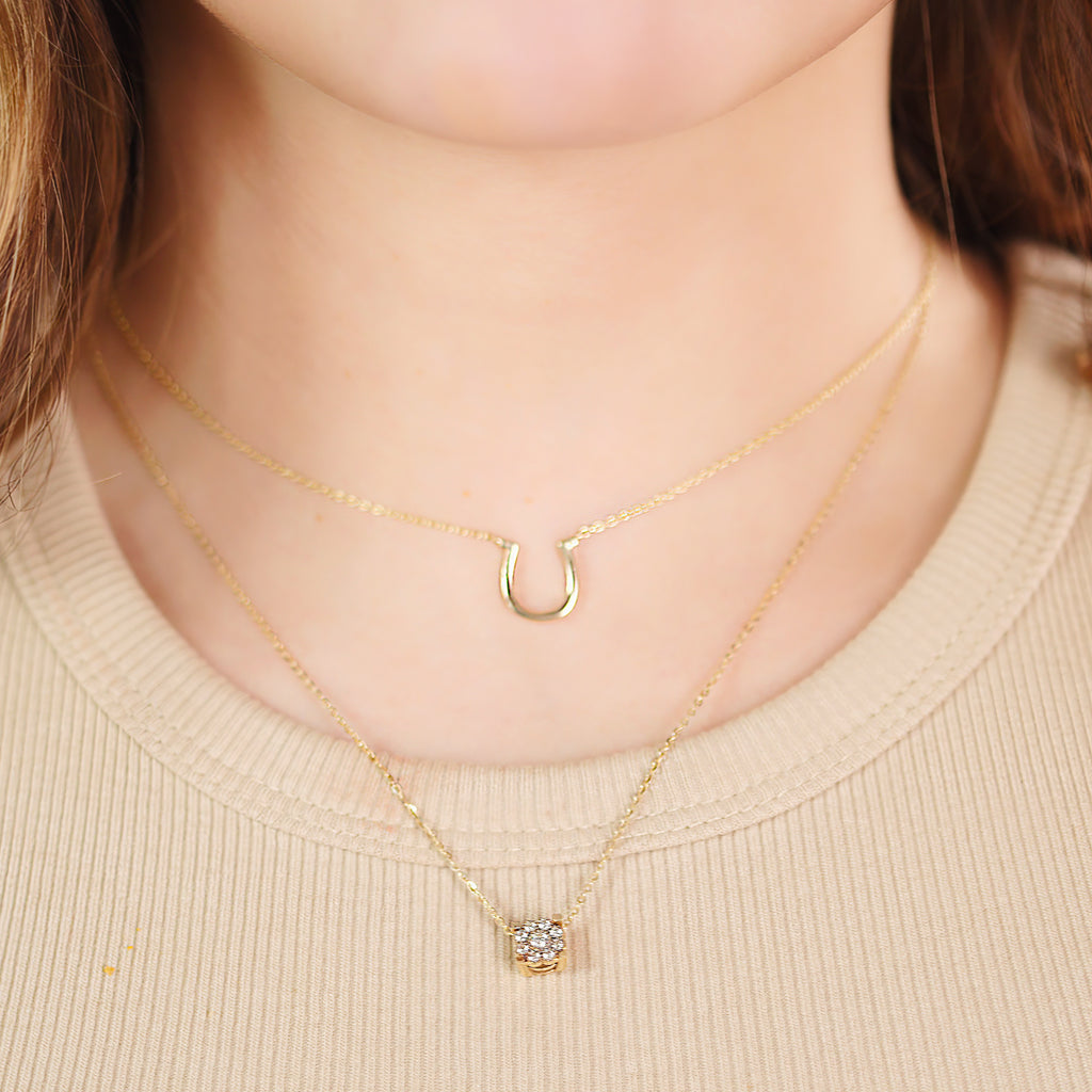 Flower Pendant Necklace 14k gold stacked on model neck – Foundry