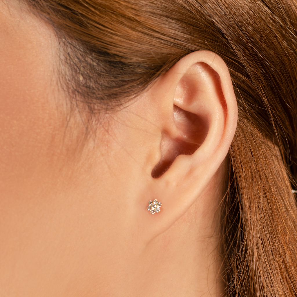 Flower Studs  14k gold stacked with model ear – Foundry