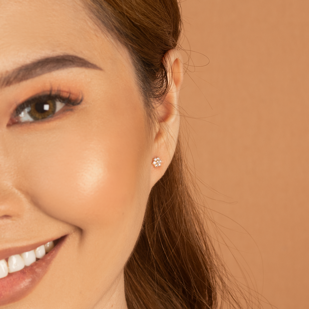 Flower Studs  14k gold stacked with model ear – Foundry