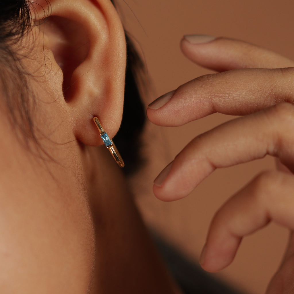 Gemstone U Hoops 18k gold stacked on model ear– Foundry