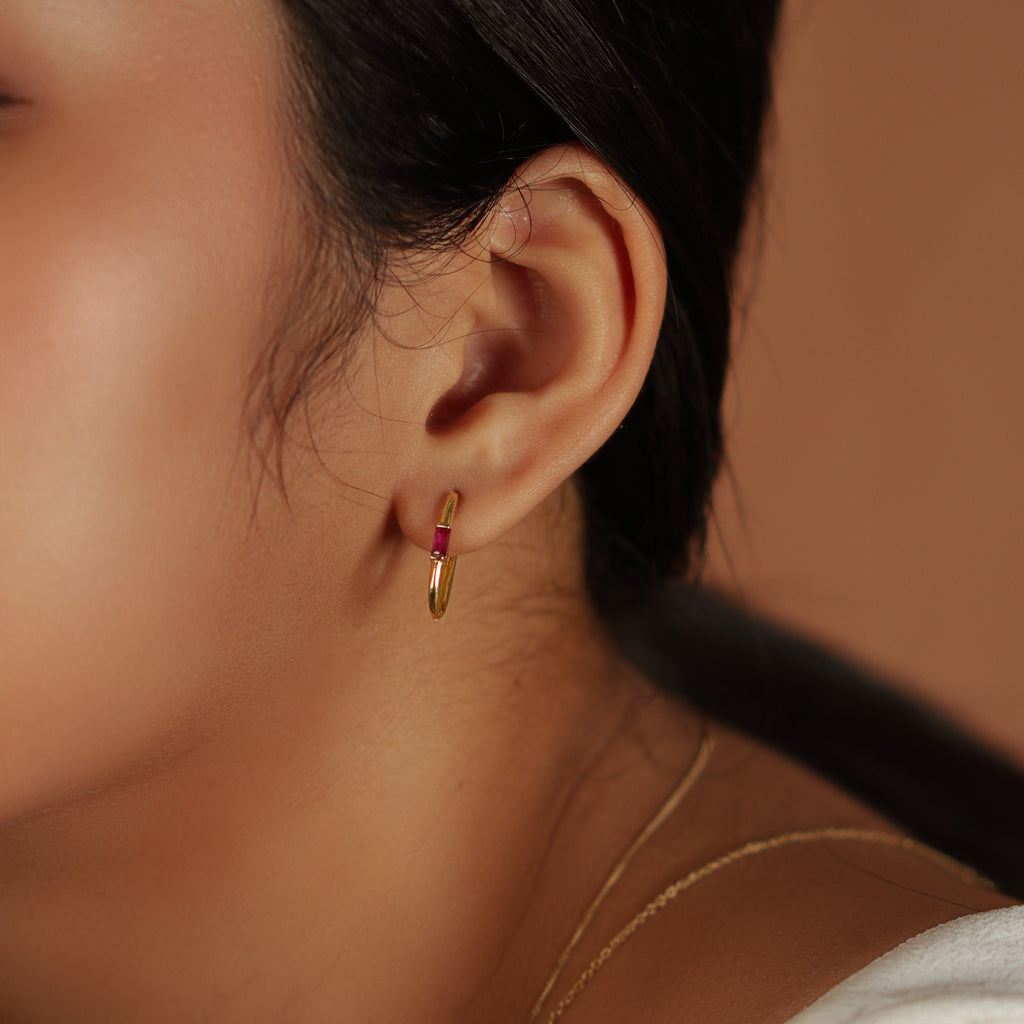 Gemstone U Hoops 18k gold stacked on model ear – Foundry