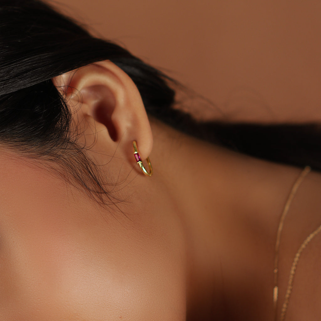 Gemstone U Hoops 18k gold stacked on model ear – Foundry