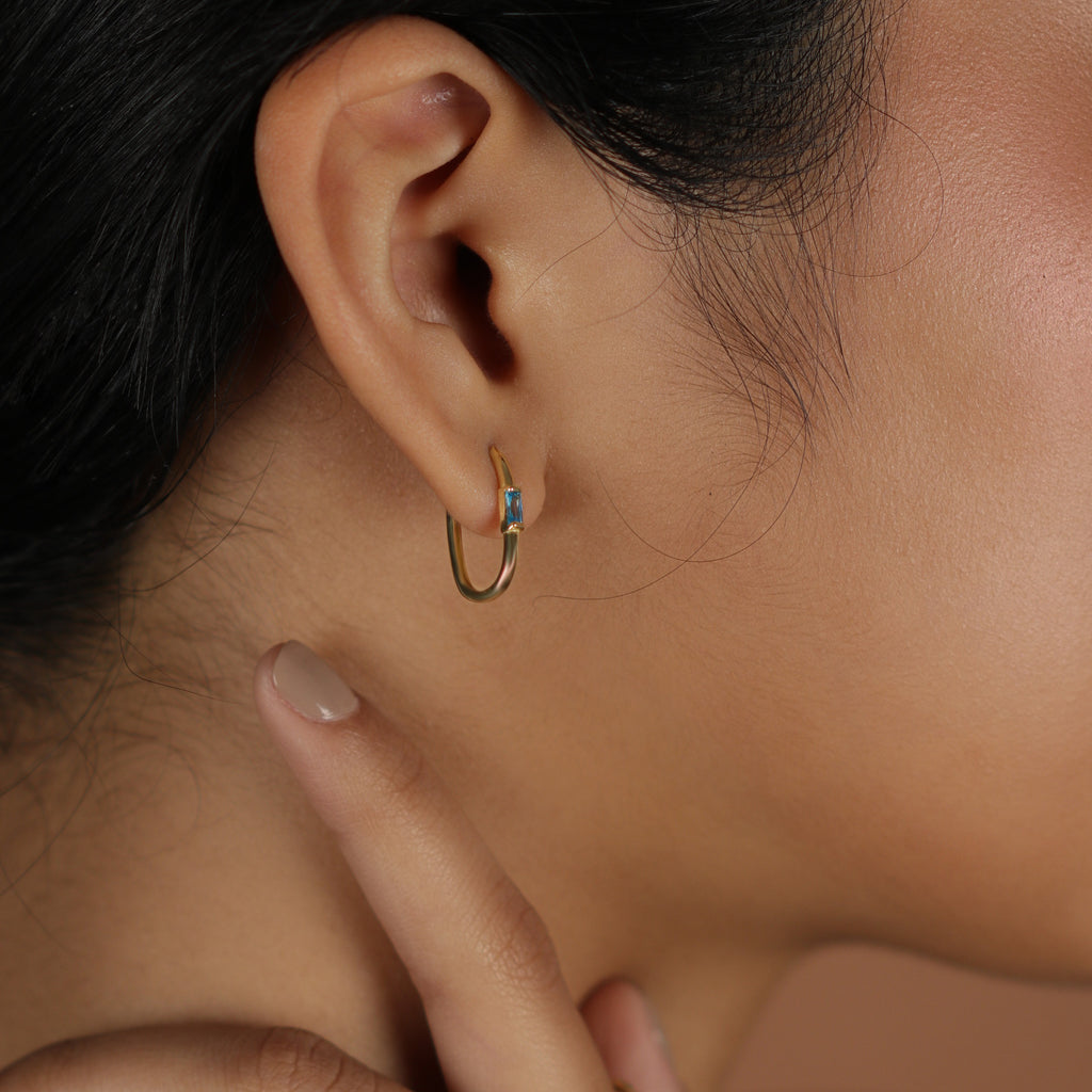 Gemstone U Hoops 18k gold stacked on model ear– Foundry