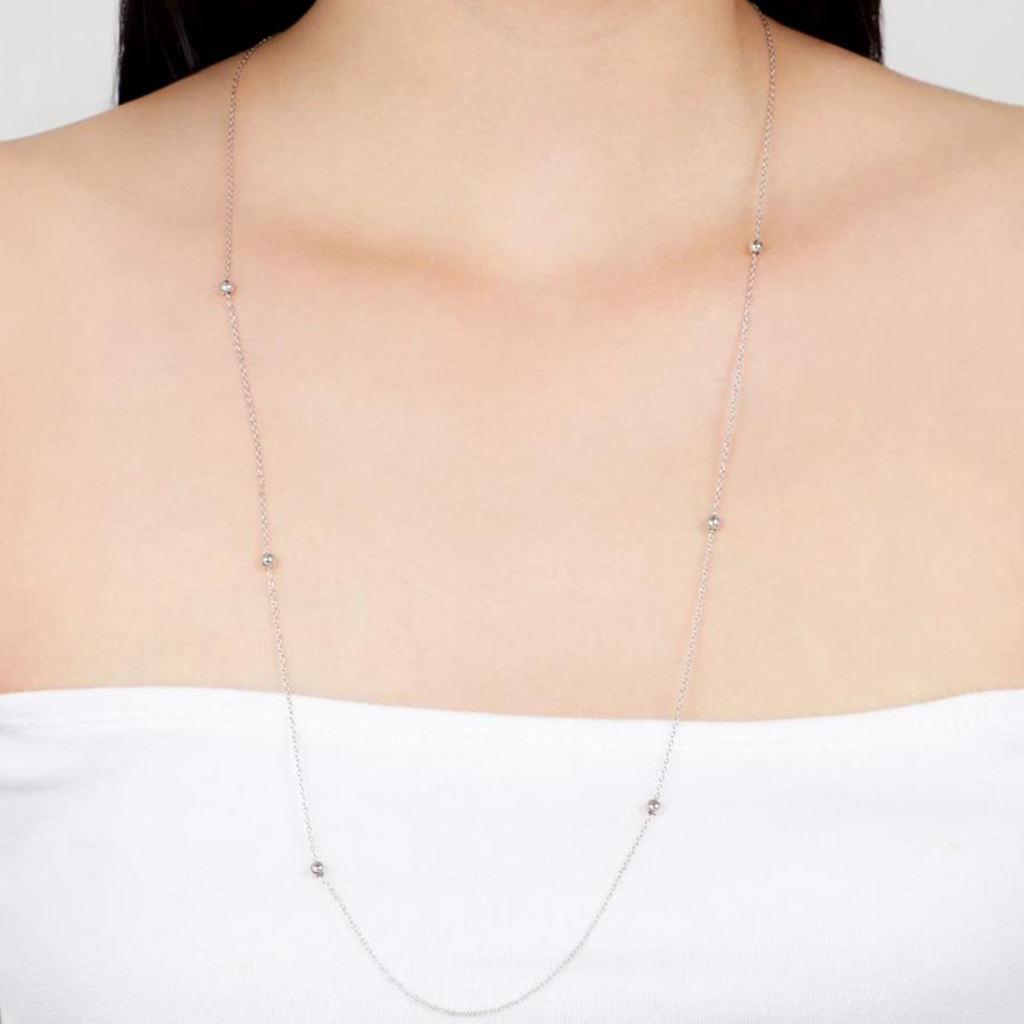 Infinity Long Chain Necklace Sterling Silver stacked on model neck – Foundry