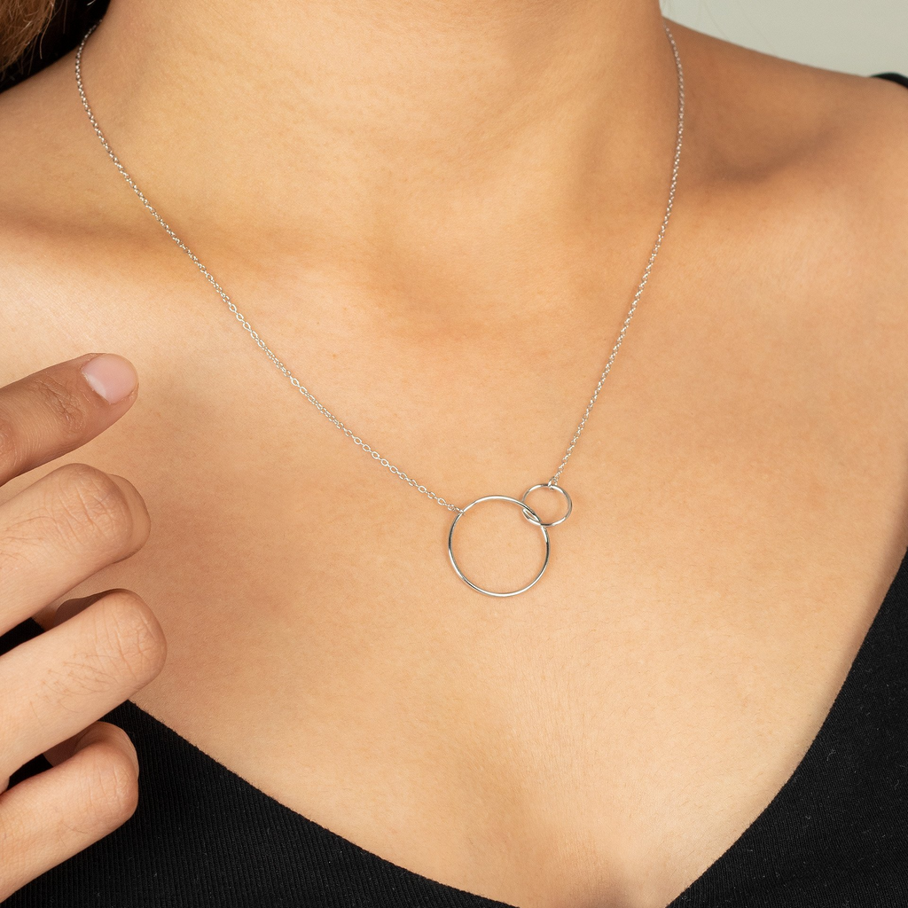 Interlocking Circle Necklace Sterling Silver stacked on model neck – Foundry