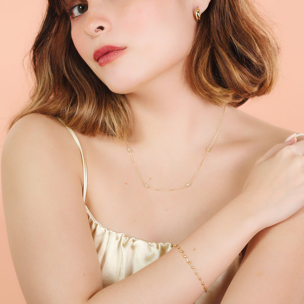 Large Beads Bracelet 14k gold stacked on model wrist – Foundry