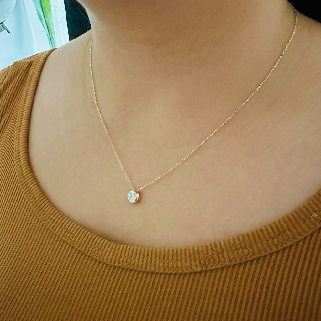 Large Bezel Necklace 14k gold stacked on model neck – Foundry