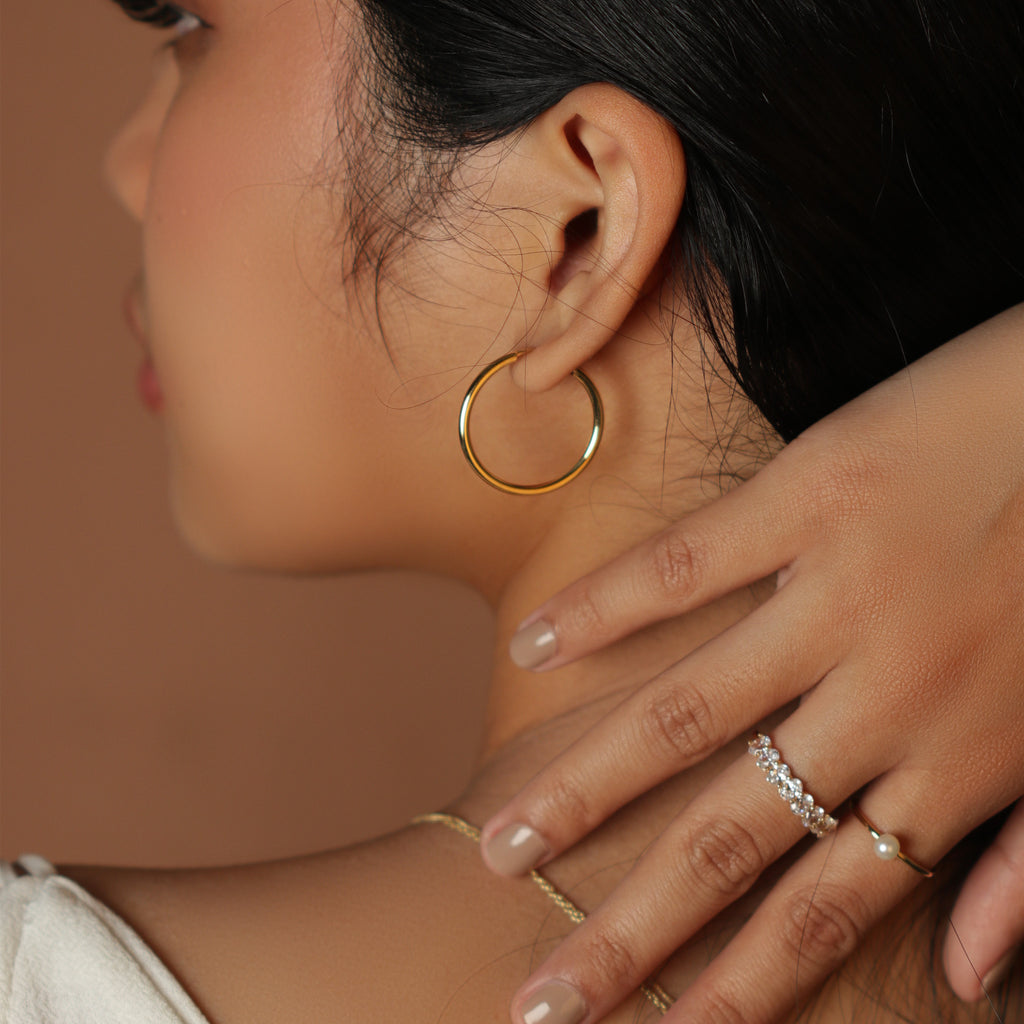 Large Easy Hoops 18k gold stacked on model ear – Foundry