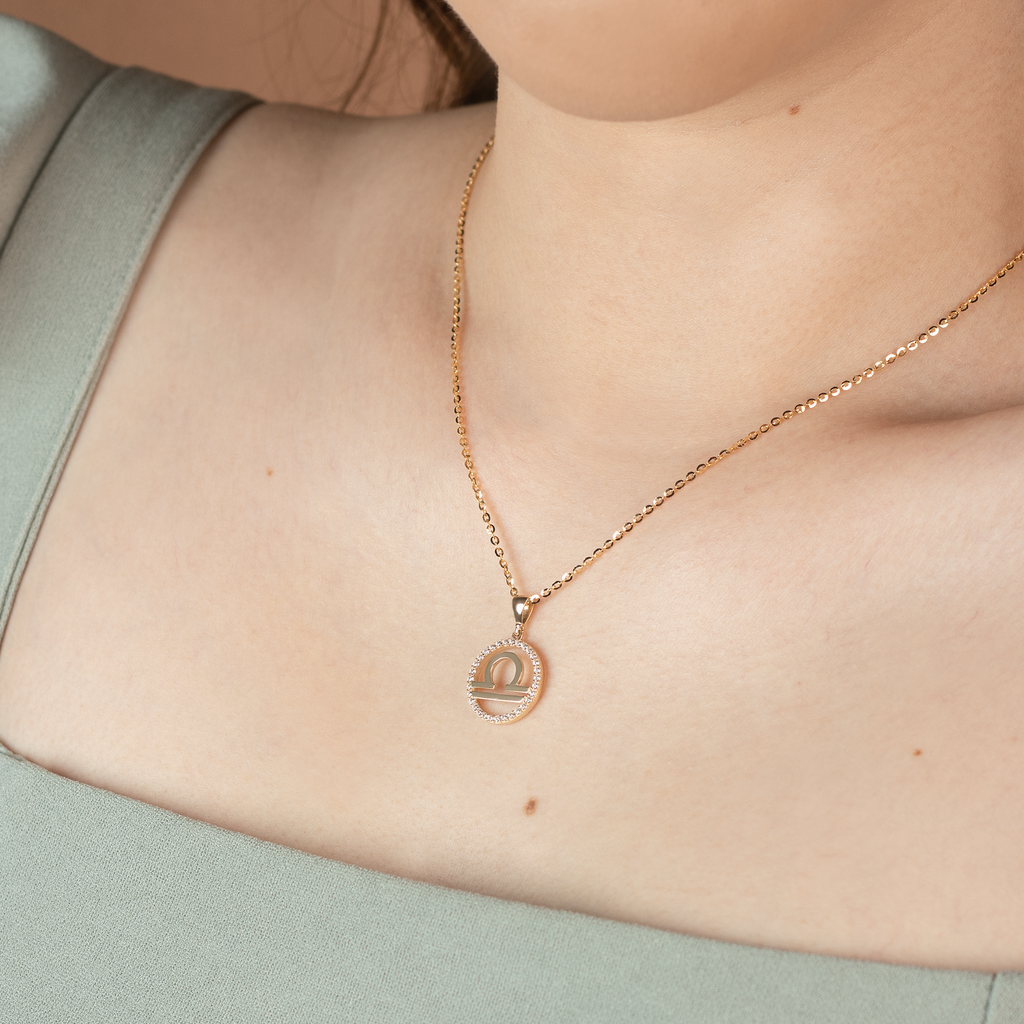 Libra Pendant 14k gold stacked on model neck – Foundry