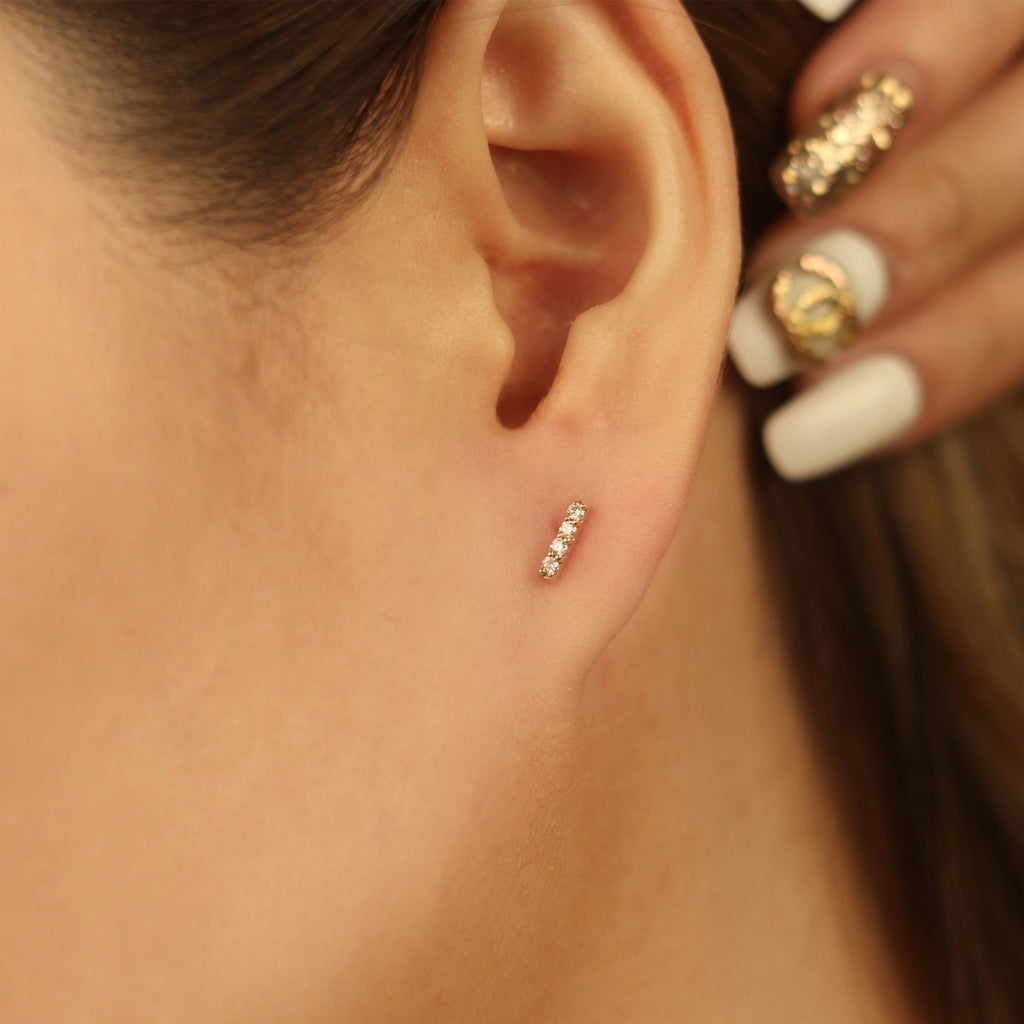 Long Diamond Bar Studs 14k gold stacked on model ear – Foundry