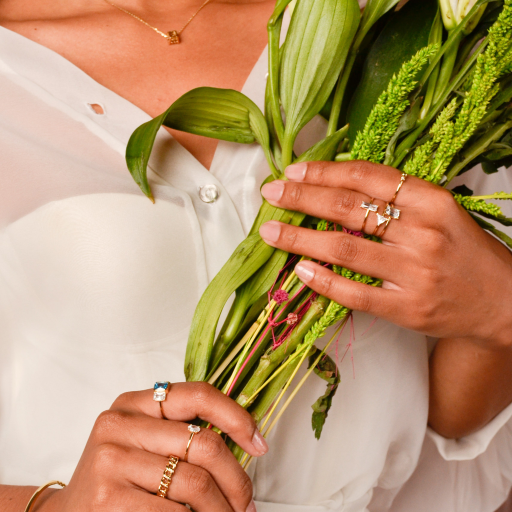 Mini Oval Ring 14k gold stacked on model finger – Foundry